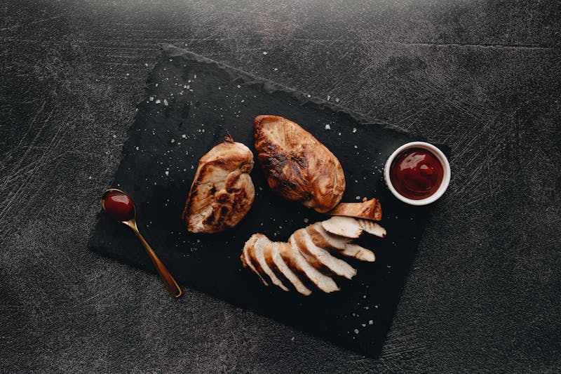 BBQ chicken pizza with caramelized onions and fresh herbs